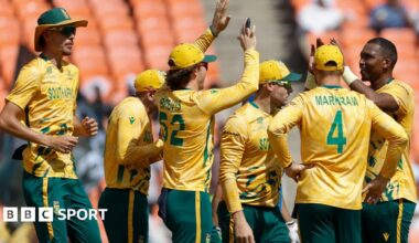 Lungi Ngidi of South Africa celebrates with teammates after taking the wicket of Gulbadin Naib of Afghanistan