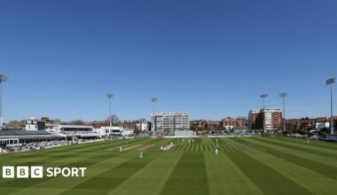 Sussex's Hove cricket ground under blue skies and players out on field in whites
