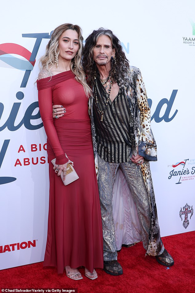 The Elizabeth Taylor AIDS Foundation ambassador made sure to pose with the man of the hour, Steven Tyler, who's the founder of Janie's Fund