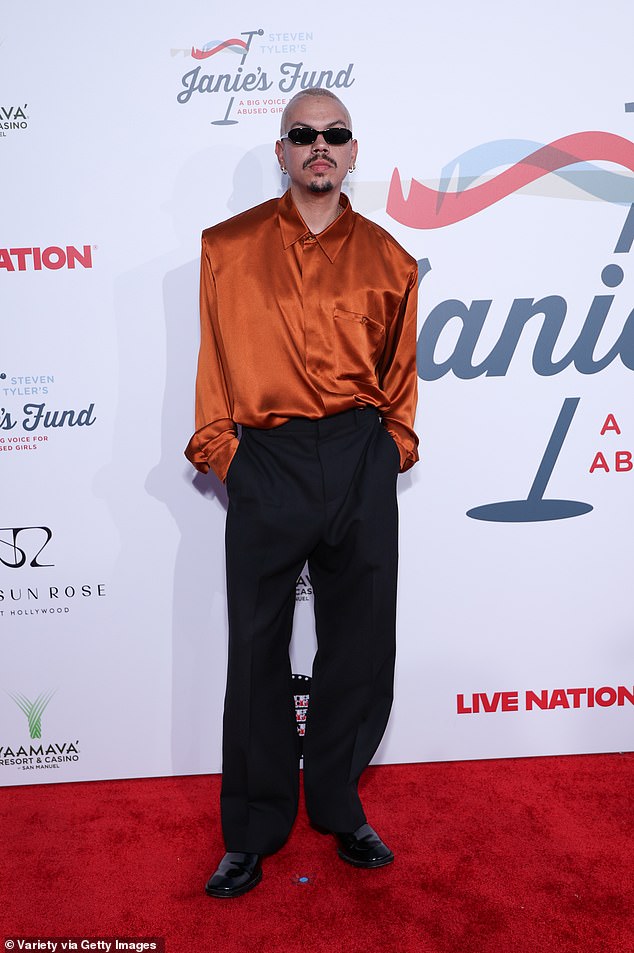Diana Ross' son Evan went for a bold look in an orange silk shirt