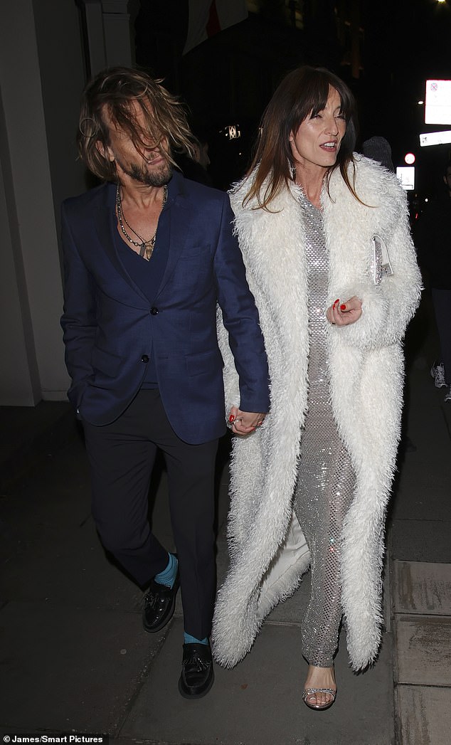 The presenter opted for a glamorous silver sequinned dress as she left the bash at London's JW Marriott Hotel