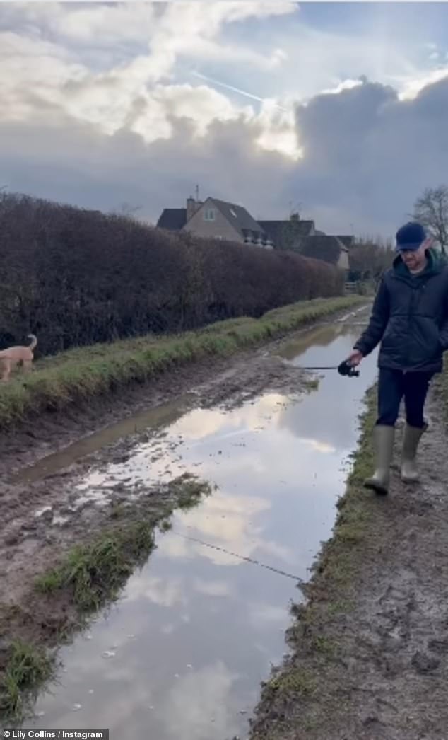 The couple's dog also joined them on the retreat with the couple enjoying a muddy stroll through the park