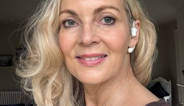 Alice Smellie with her Sona – a vagus nerve-stimulating earpiece – which she believes has given her a calmer outlook