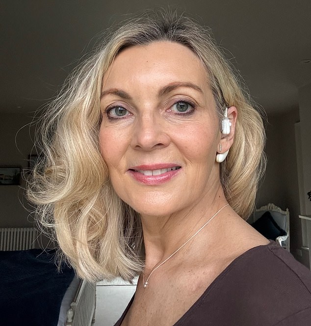 Alice Smellie with her Sona – a vagus nerve-stimulating earpiece – which she believes has given her a calmer outlook