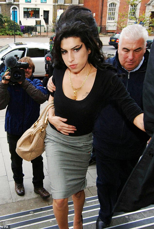 Winehouse arrives with her father Mitch at Thames Magistrates Court to see Fielder-Civil appear on charges of perverting the course of justice, 2007