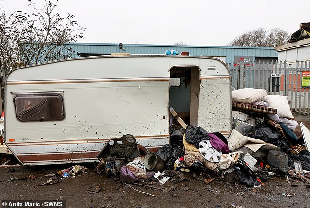 A caravan is among the items which have been dumped alongside car parts and household waste