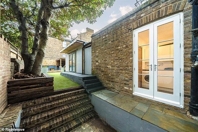 Images from the listing show of the property's well maintained but narrow garden which backs onto the station