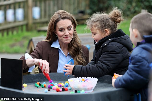 Kate enjoyed some arts and crafts - and also games - during the visit, where she also got to chat to pupils