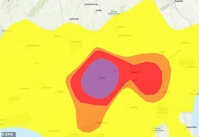 Air quality readings in Southern Georgia have reached 'very unhealthy' levels Friday (Pictured in purple), triggering warnings to stay indoors