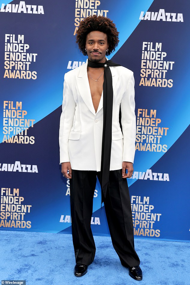 Dewayne Perkins went shirtless under a white blazer, which he paired with black pants and a black scarf