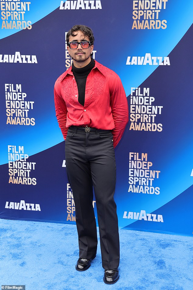 Michael Cimino opted for a pop of color in a Western shirt and black pants