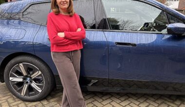 Angela Epstein with her husband’s electric BMW iX40, which makes her feel ill