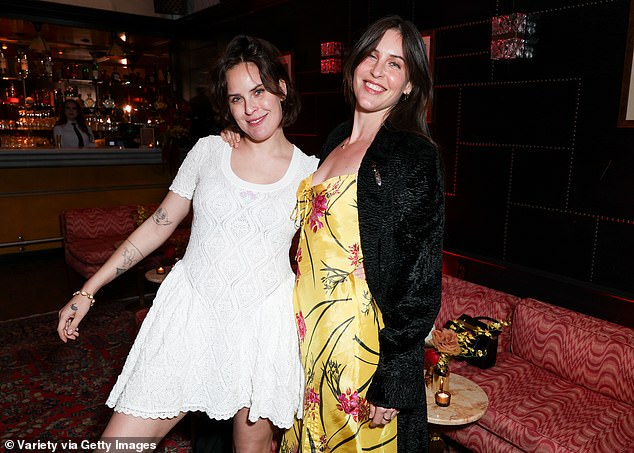 The stylish ensemble featured spaghetti-strap shoulders, a tie-up detail at the bust, a gorgeous pink floral print throughout, and a draped silhouette