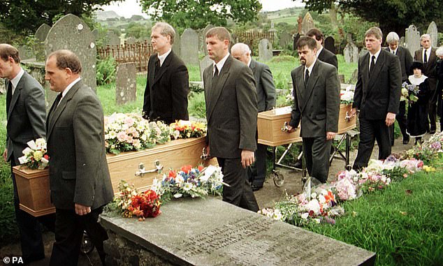 Pictured: Shaun and Josie Russell follow the coffins of Lin and Megan at their funeral in Dolbamaen, North Wales, in October 1996