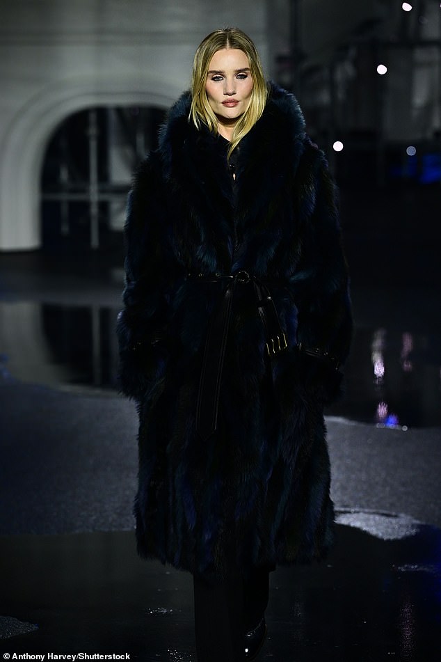 Rosie Huntington-Whiteley walked the Burberry runway during London Fashion Week on Monday night as her proud fiancé Jason Statham watched on