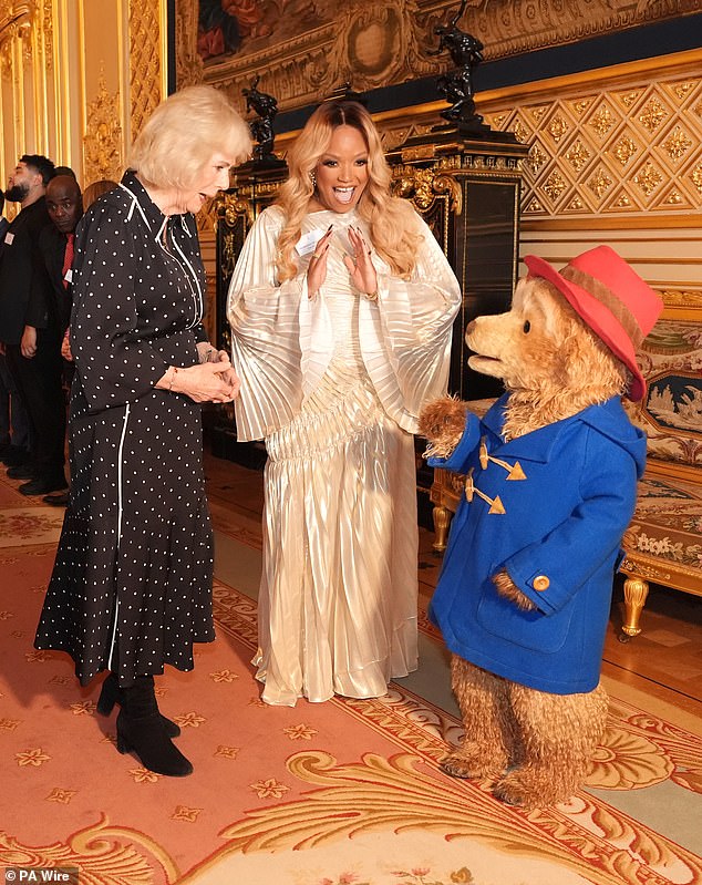 Paddington Bear stopped by the Queen's reception for the finalists of the BBC 500 Words competition, as he was joined by actress Marisha Wallace (centre)