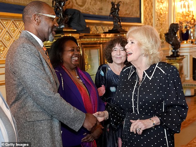 Queen Camilla shares a laugh with Sir Lenny Henry, one of the judges of this year's edition of the literary prize for emerging talent