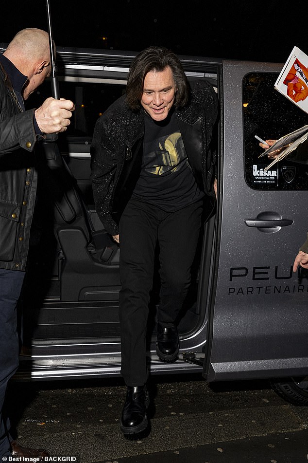 He wore a casual black T-shirt under a glitzy blazer as he was swarmed by fans upon entering the lavish eatery