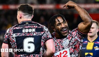 Leigh Leopards player Edwin Ipape celebrates his try against Leeds Rhinos as teammate Adam Cook goes to congratulate him.