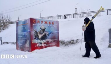 A recruitment poster in the Russian town of Yelets promises big sums of money for anyone who joins up. It shows a man in uniform pointing a rifle to the right