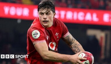 Louis Rees-Zammit of Wales runs with the ball in hand