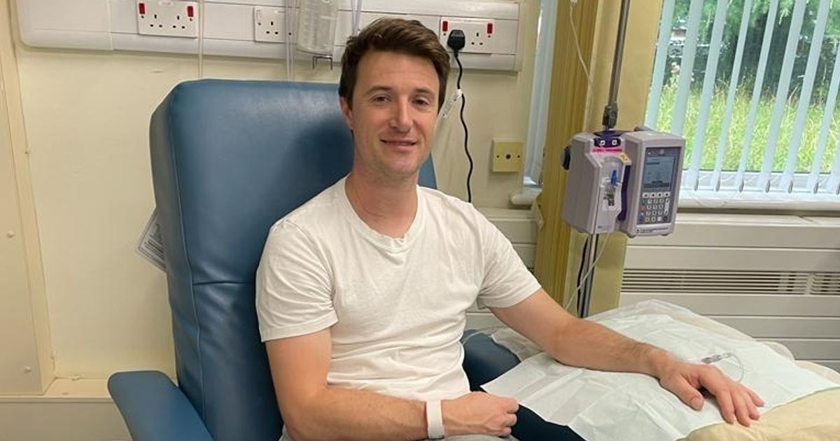 A smiling family of 4 on a walk