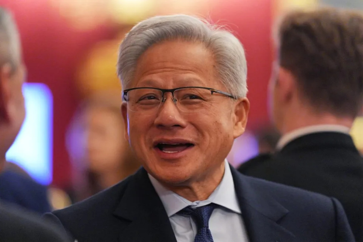 Nvidia CEO Jensen Huang speaking at a tech conference, emphasizing AI advancements and industry innovation.