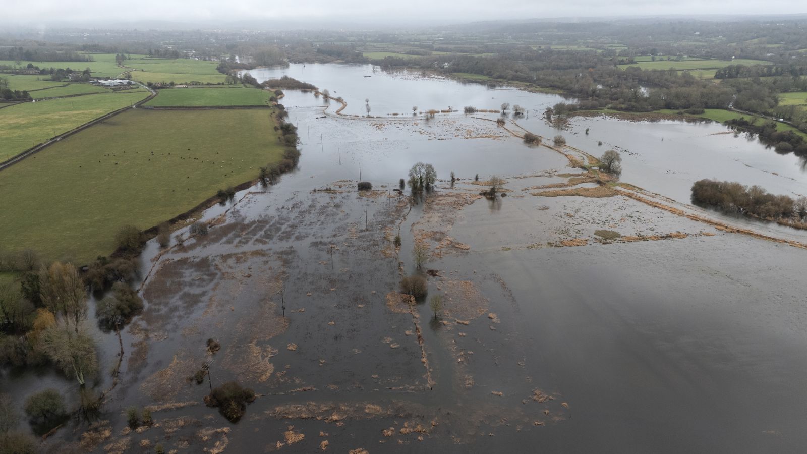 Floodwater cover fields near to Harbridge in Hampshire. Pic: PA