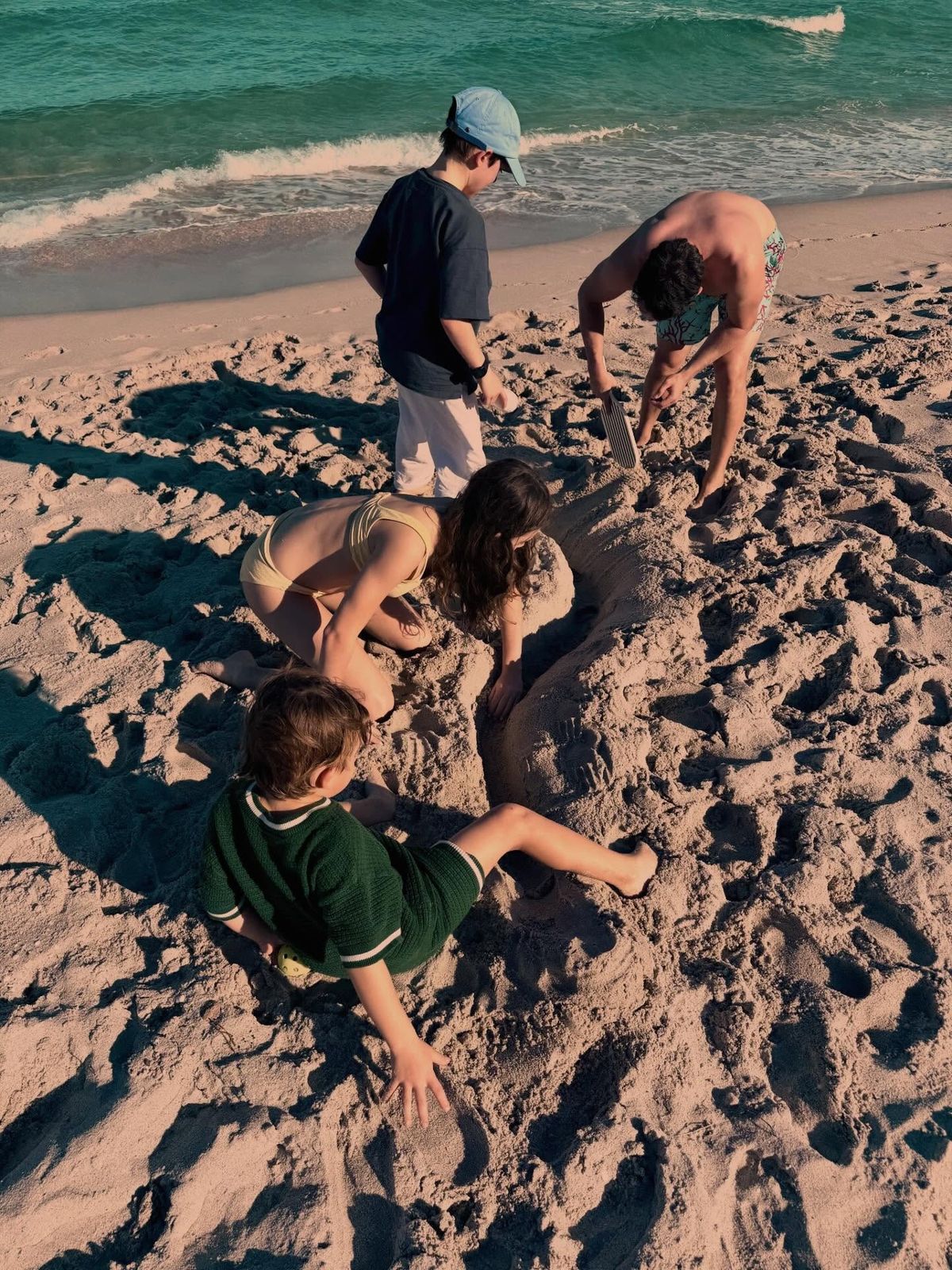 Children playing in the sand on a beach