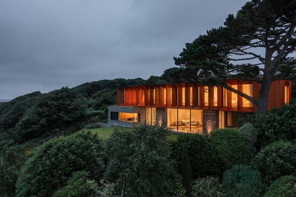Six projects shortlisted for RSAW Welsh Architecture Awards 2026 - this is Porthmadog House by Strom Architects Nestled into the north west Wales coastline surrounded by trees and with a sea view