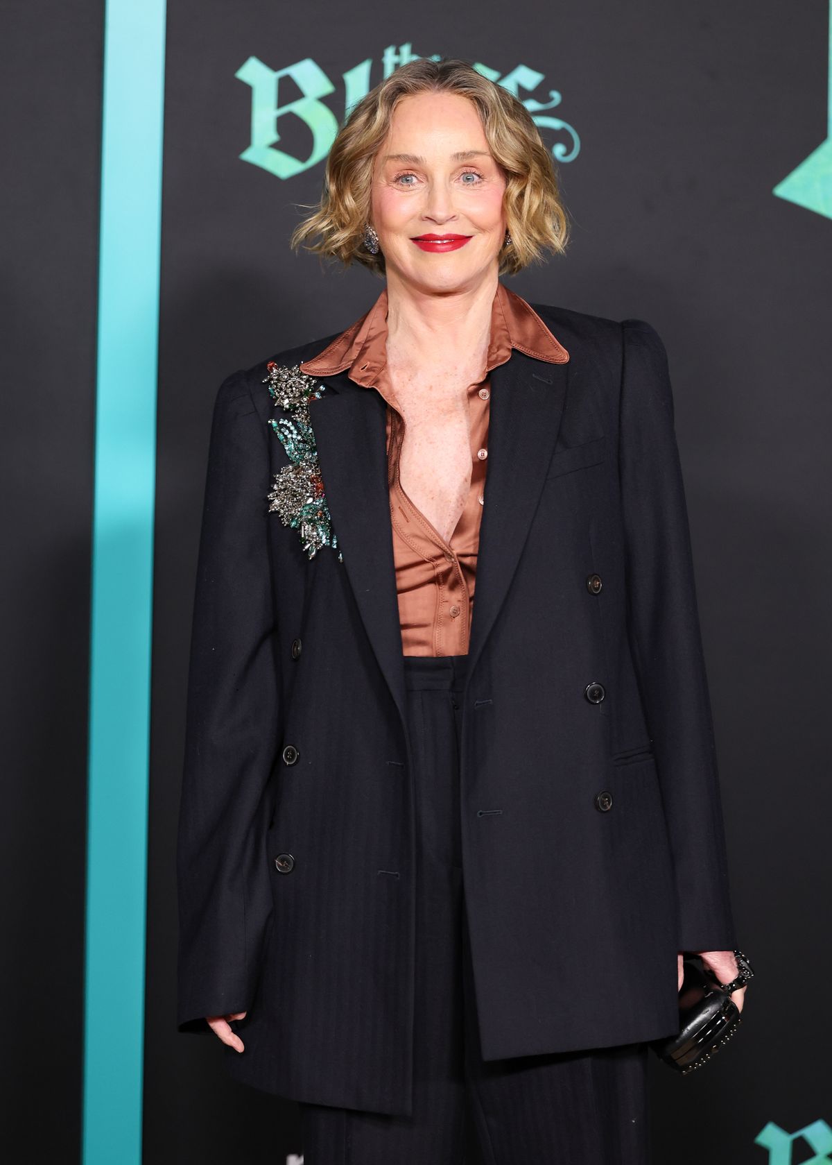 Sharon added to her glowing appearance with pink blush