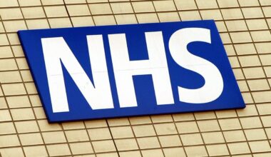 NHS staff in uniform providing care at a hospital, showcasing dedication and teamwork in the healthcare sector