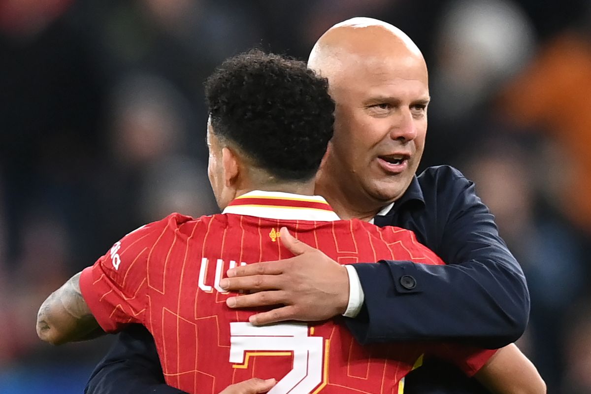 LIVERPOOL, ENGLAND - NOVEMBER 27: Liverpool manager Arne Slot celebrates with Liverpool's Luis Diaz   during the UEFA Champions League 2024/25 League Phase MD5 match between Liverpool FC and Real Madrid C.F. at Anfield on November 27, 2024 in Liverpool, England. (Photo by Richard Martin-Roberts - CameraSport via Getty Images)