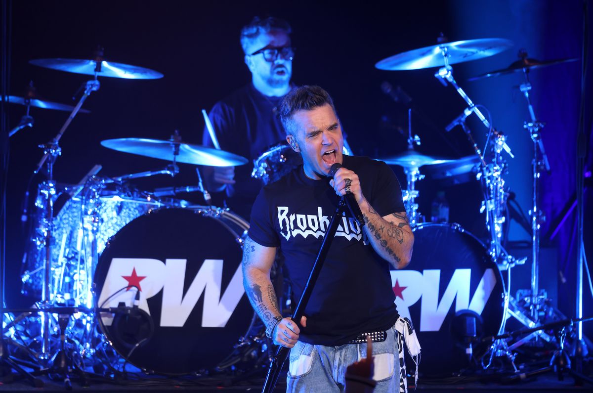 Robbie Williams performs on stage at the Liverpool Olympia