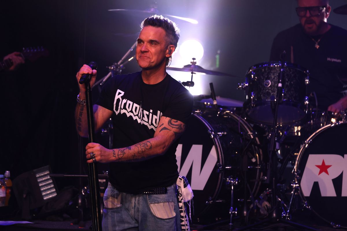 Robbie Williams performs on stage at the Liverpool Olympia