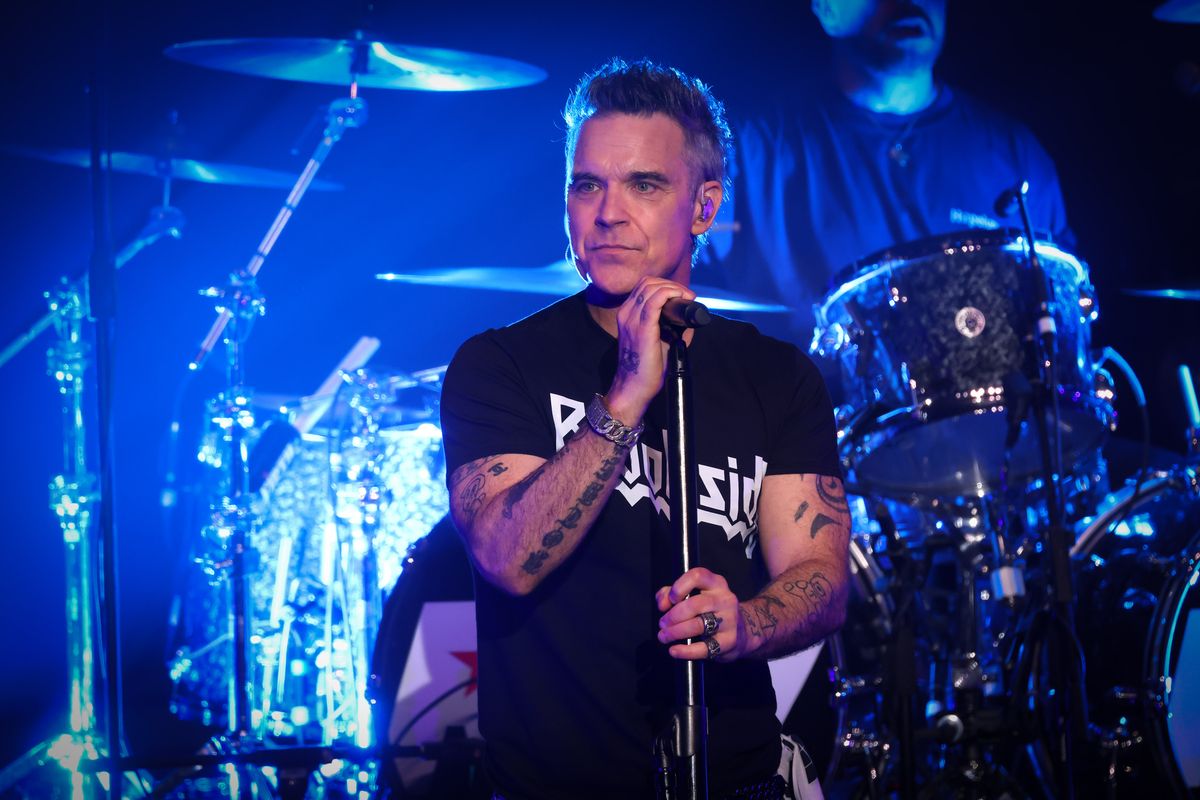 Robbie Williams performs on stage at the Liverpool Olympia