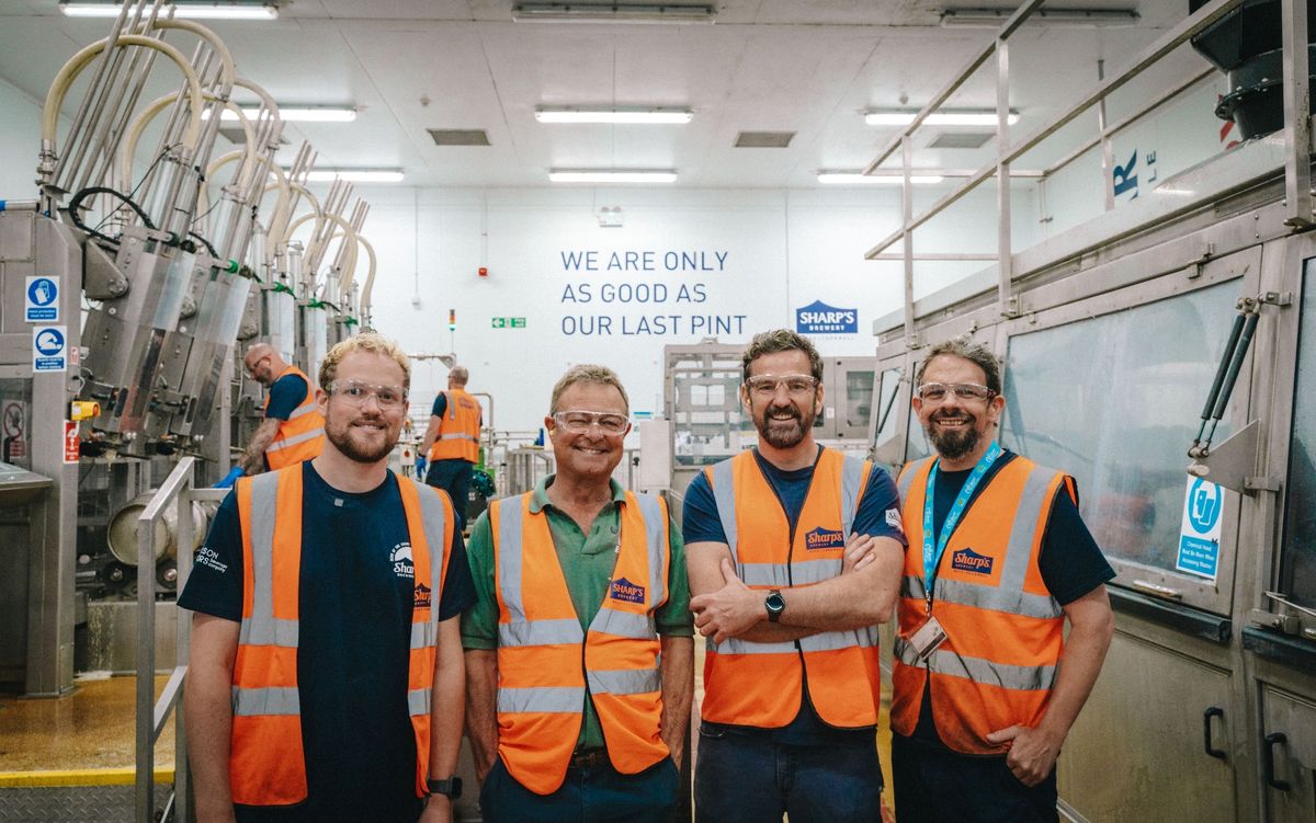 Bill Sharp (green shirt) returned to the brewery he founded in 1994 for its 30th anniversary and found that his slogan about quality is still a mantra staff abide by 