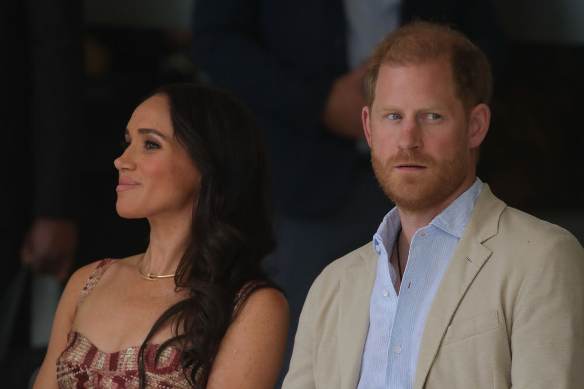 Meghan Markle and Prince Harry are pictured at an event during a royal tour