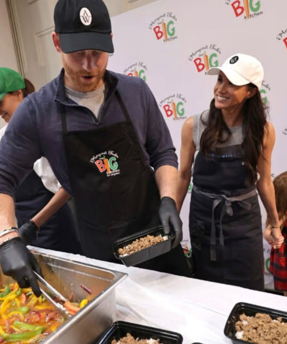 The Duke and Duchess of Sussex are snapped volunteering at a soup kitchen in Los Angeles