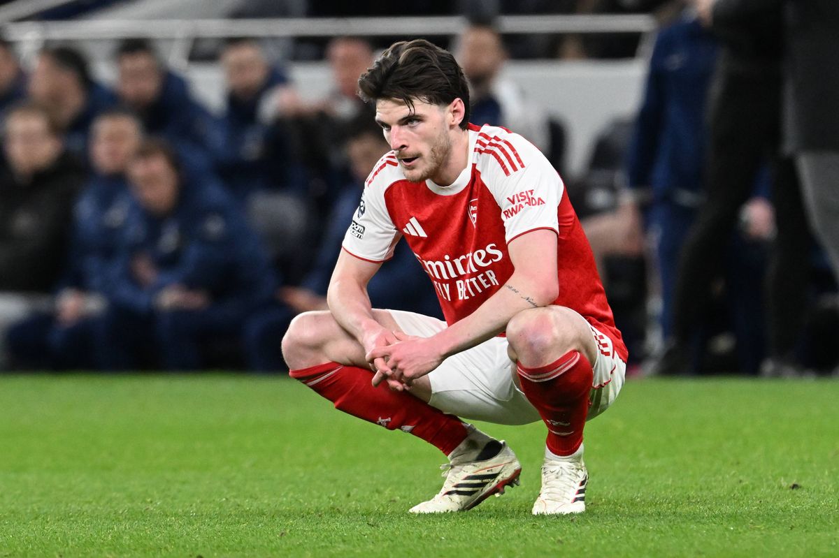Declan Rice squats on the pitch