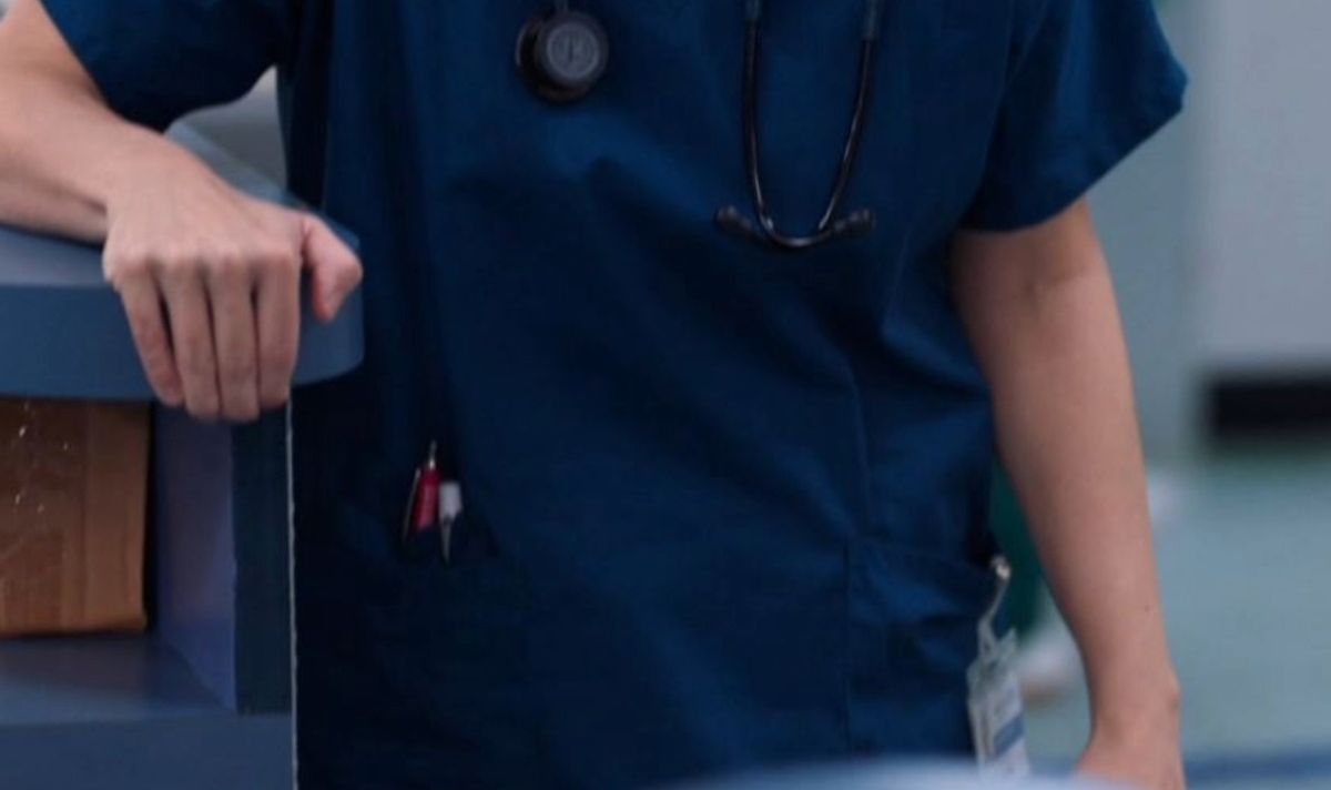 A closeup of a nurse's stomach in uniform