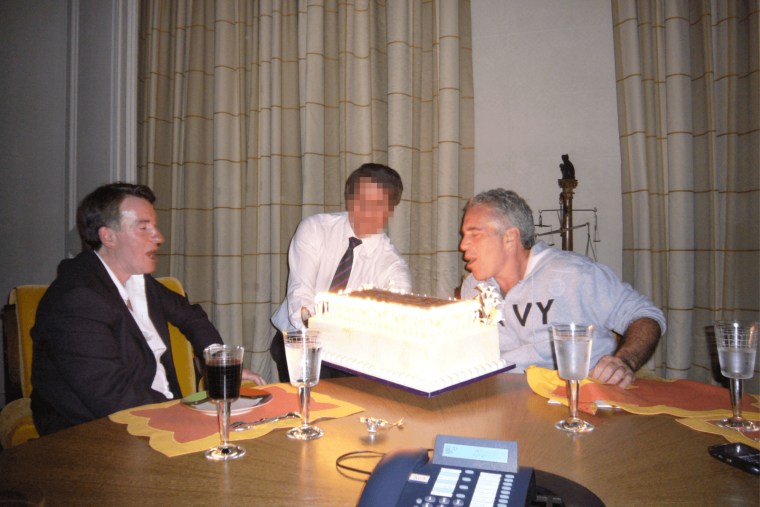 Peter Mandelson and Jeffrey Epstein with a birthday cake.