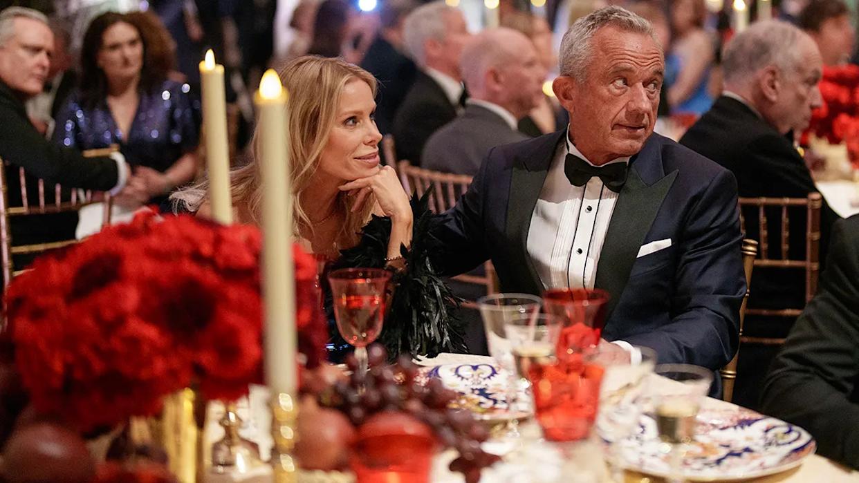 Robert F. Kennedy Jr., U.S President-elect Donald Trump's pick for Secretary of Health and Human Services, and his wife Cheryl Hines attend the Vice Presidential Dinner at the National Gallery of Art on January 18, 2025 in Washington, DC, seen sitting at dinner table.