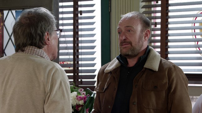 Mal talking to Roy in the café in Corrie