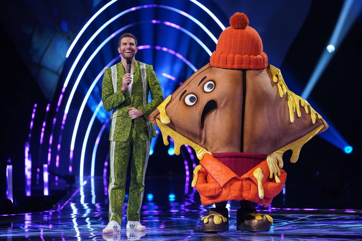 Toastie alongside host Joel Dommett on The Masked Singer