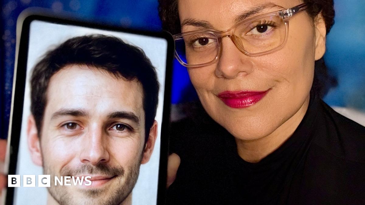 A woman with clear glasses and bright red lipstick smiles as she holds her phone to the camera showing a picture of her AI companion.  On the phone is a picture of a man with short cropped hair, a slight beard and smiling eyes.