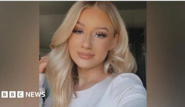 Lucy Harrison, who has long blonde hair resting on top of her head, smiles at the camera