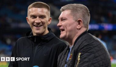 Campbell Hatton stands and laughs alongside his father Ricky Hatton