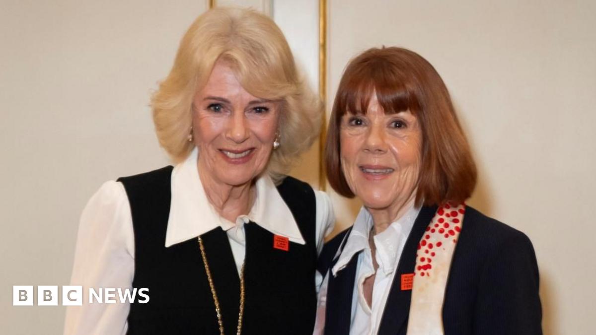 Queen Camilla stood beside Gisèle Pelicot against a pale wall