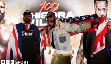 Derek Chisora stands beside Deonty Wilder as he shouts